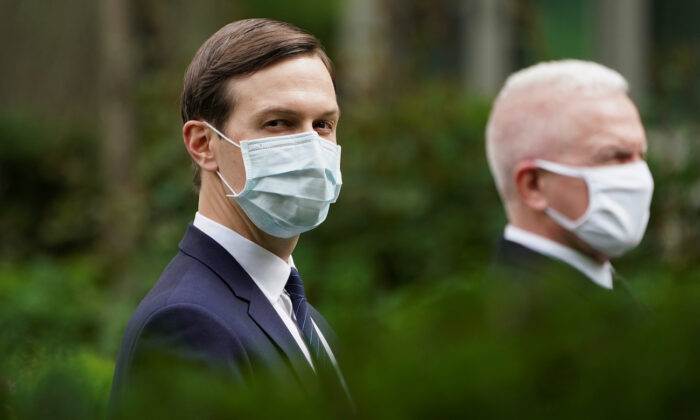 White House senior advisor to the president Jared Kushner and Admiral Brett Giroir, U.S. Assistant Secretary for Health, wear protective face masks in the Rose Garden as President Donald Trump holds a COVID-19 response press briefing at the White House in Washington on May 11, 2020. (Kevin Lamarque/Reuters)