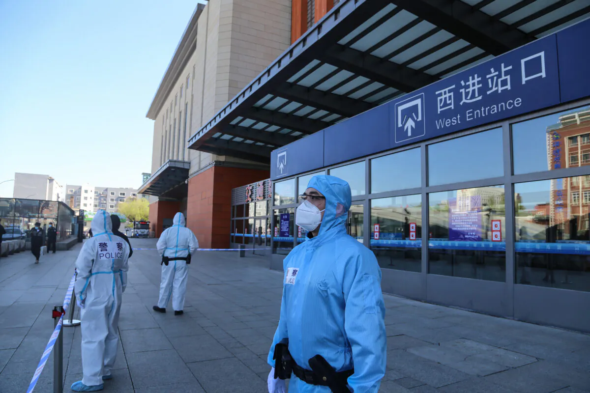 Police officers stand guard outside Jilin city's railway station which is closed due to the CCP virus outbreak in Jilin, China on May 13, 2020. (STR/AFP via Getty Images)