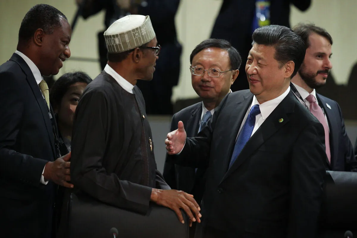 Chinese leader Xi Jinping (R) greets President of Nigeria Muhammadu Buhari (L) during a plenary session of the 2016 Nuclear Security Summit in Washington on April 1, 2016. (Alex Wong/Getty Images)