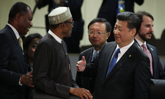 Chinese leader Xi Jinping (R) greets President of Nigeria Muhammadu Buhari (L) during a plenary session of the 2016 Nuclear Security Summit in Washington on April 1, 2016. (Alex Wong/Getty Images)