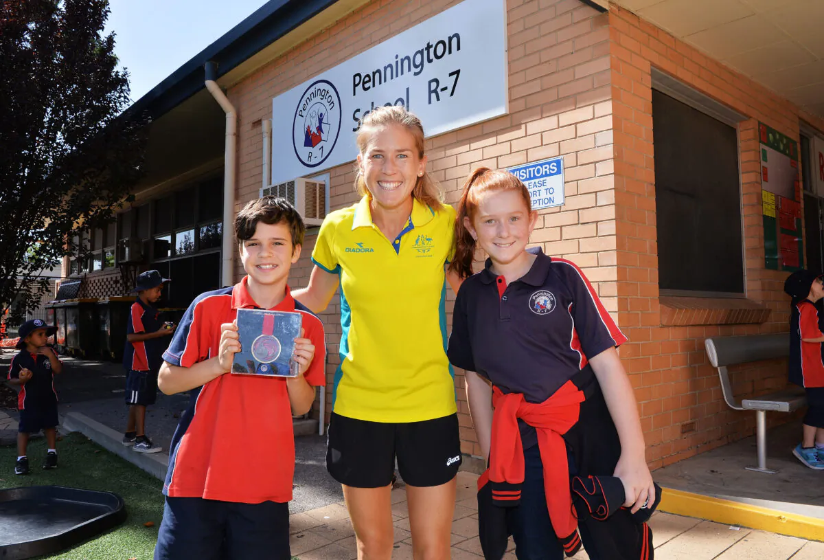 Jess Trengove welcomed by students Jamie Phillips and Caitlin Mitchell during the Commonwealth Games Schools Assembly at Pennington Primary School on February 14, 2018 in Adelaide, Australia.  (Mark Brake/Getty Images)