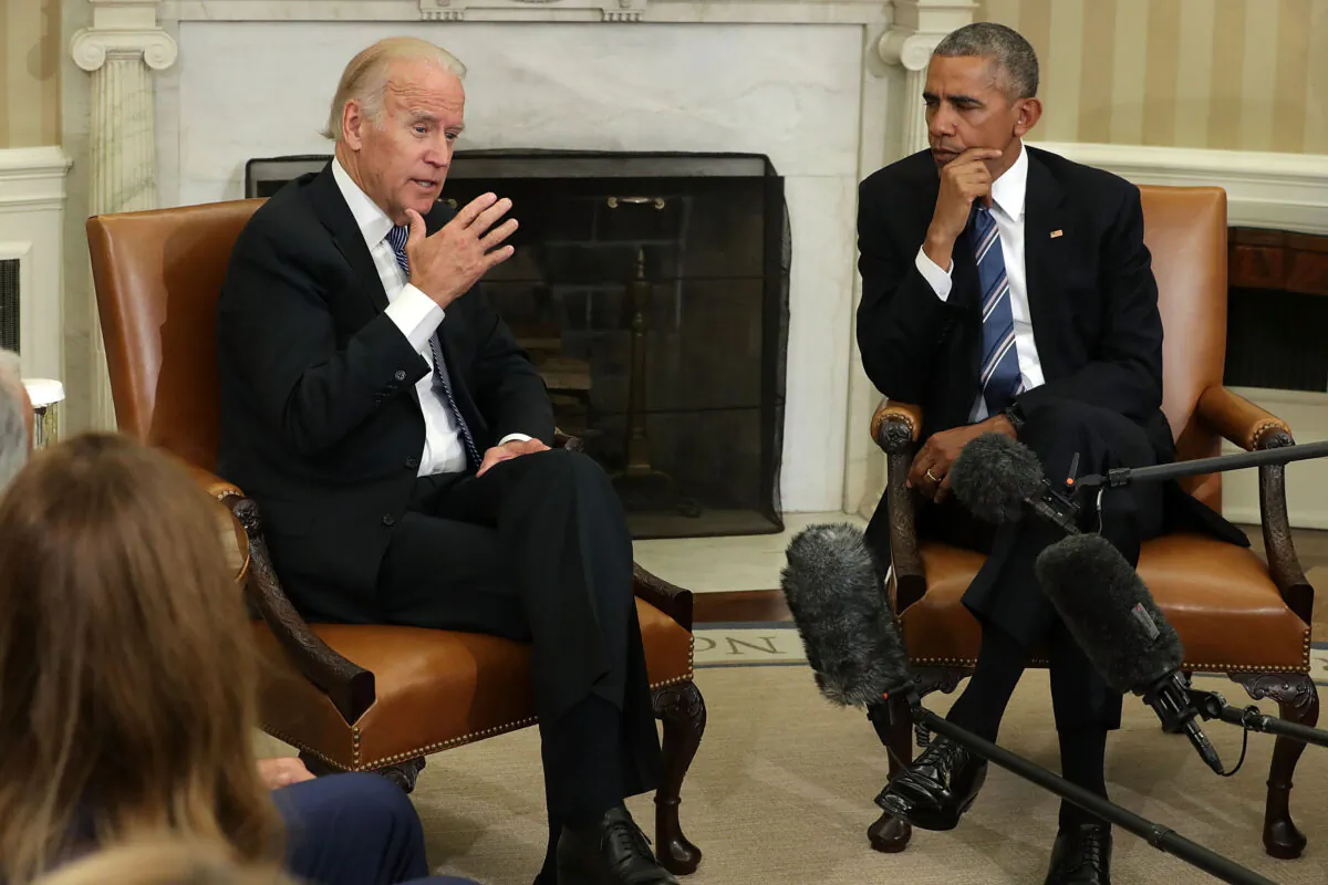 Then-Vice President Joe Biden, left, speaks as President Barack Obama listens in Washington in an Oct. 17, 2016, file photograph. (Alex Wong/Getty Images)