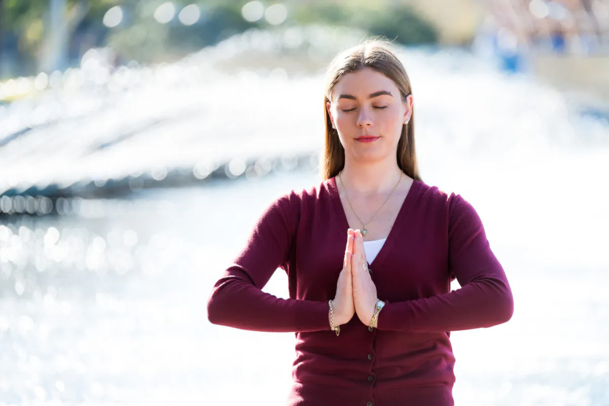 Amy Isabelle Duncan practices the Falun Dafa meditation at a park in Sydney on June 26, 2017. (Courtesy of Amy Isabelle Duncan)