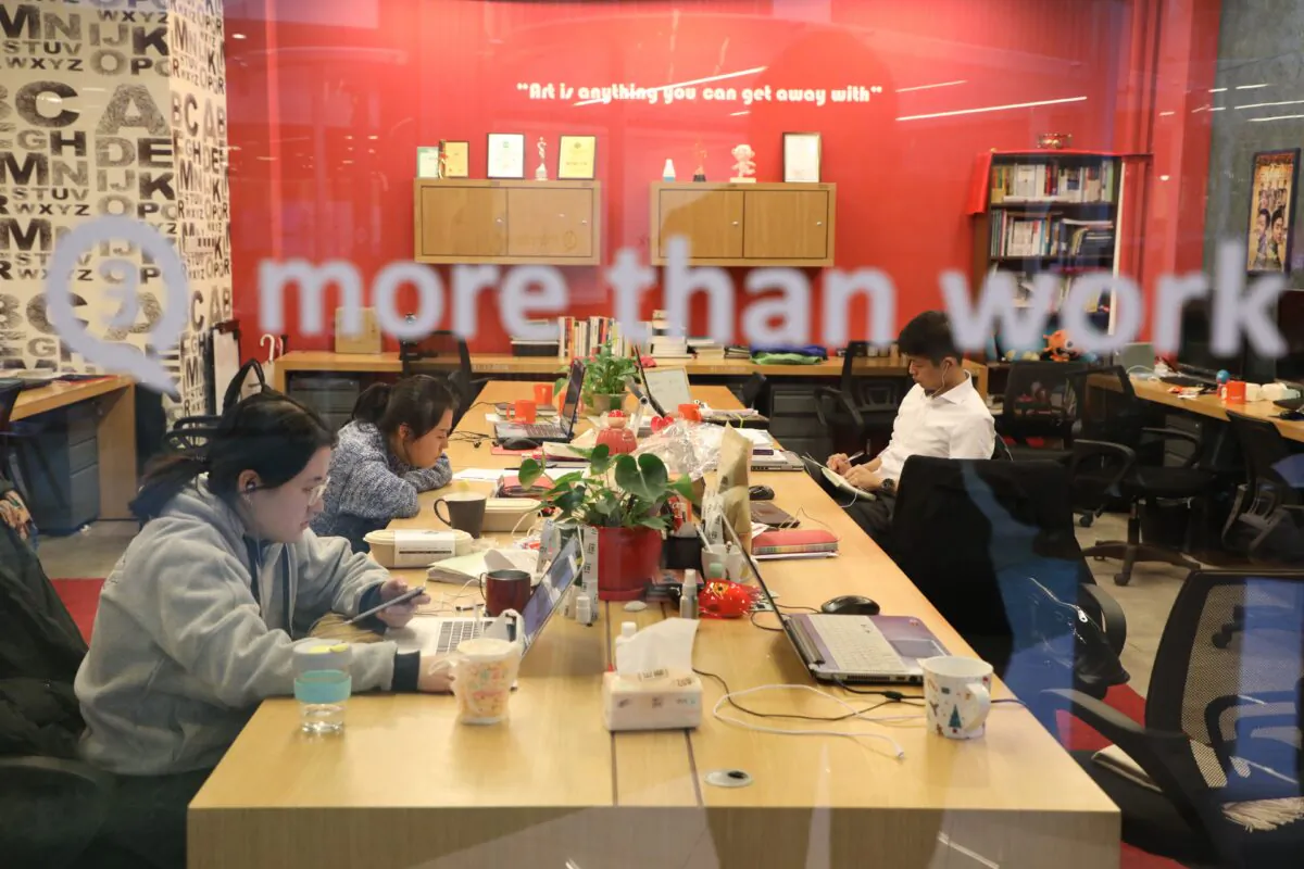 People work at start-up incubator Soho3Q in Beijing, China, on Jan. 9, 2018. (Ludovic Marin/AFP/Getty Images)