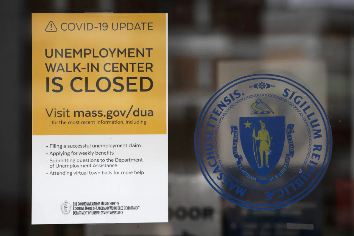 A sign announces the closure of the Massachusetts unemployment office, in Boston, on May 9, 2020. (Michael Dwyer/AP Photo)