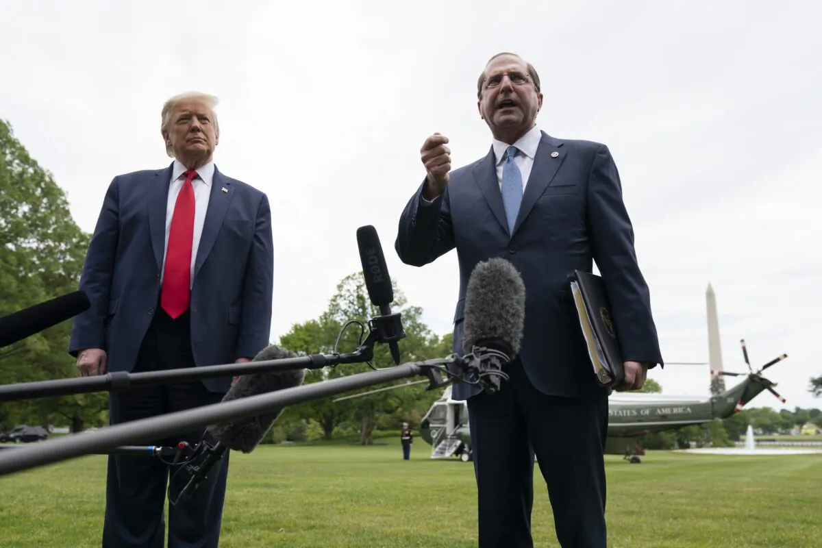 President Donald Trump (L) and Health and Human Services Secretary Alex Azar speak to reporters on his way to Marine One on the South Lawn of the White House in Washington on May 14, 2020. (Drew Angerer/Getty Images)
