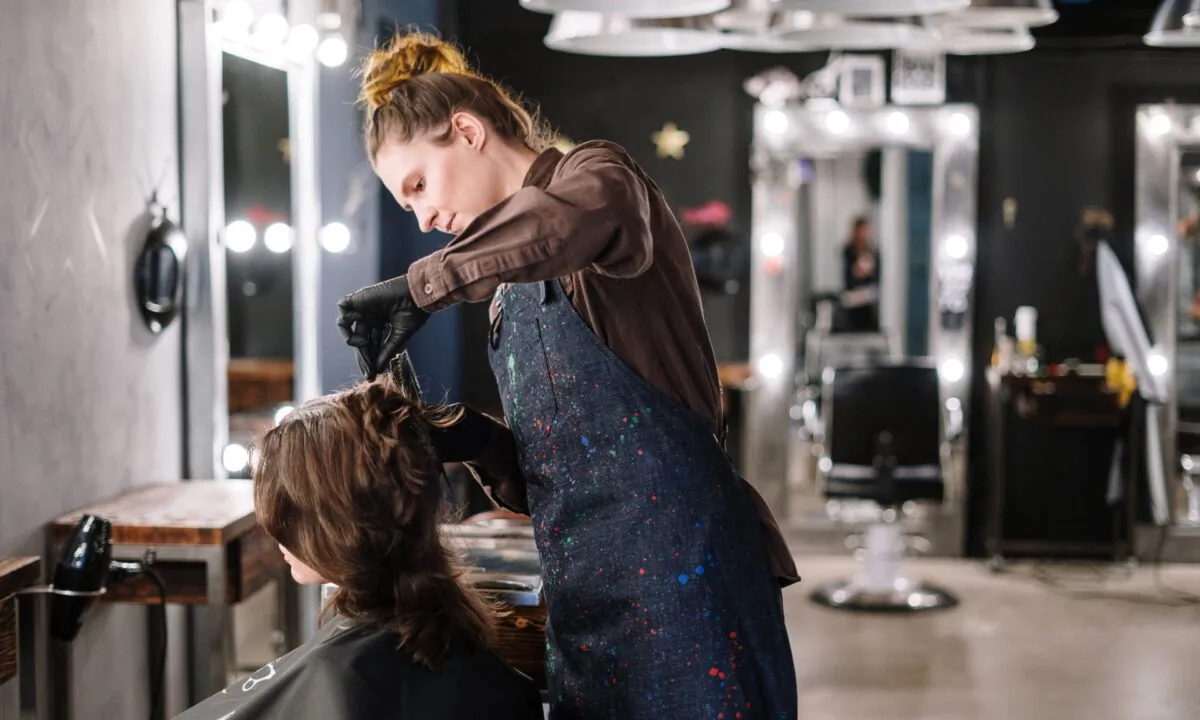 A file photo of a woman having her hair styled. (Cottonbro/Pexels)