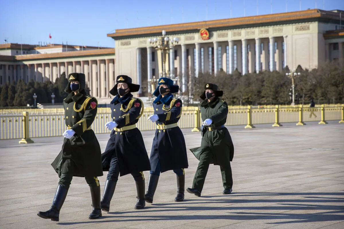 Members of a Chinese honour guard march in formation near the Great Hall of the People on Tiananmen Square in Beijing. (Mark Schiefelbein/AP Photo)