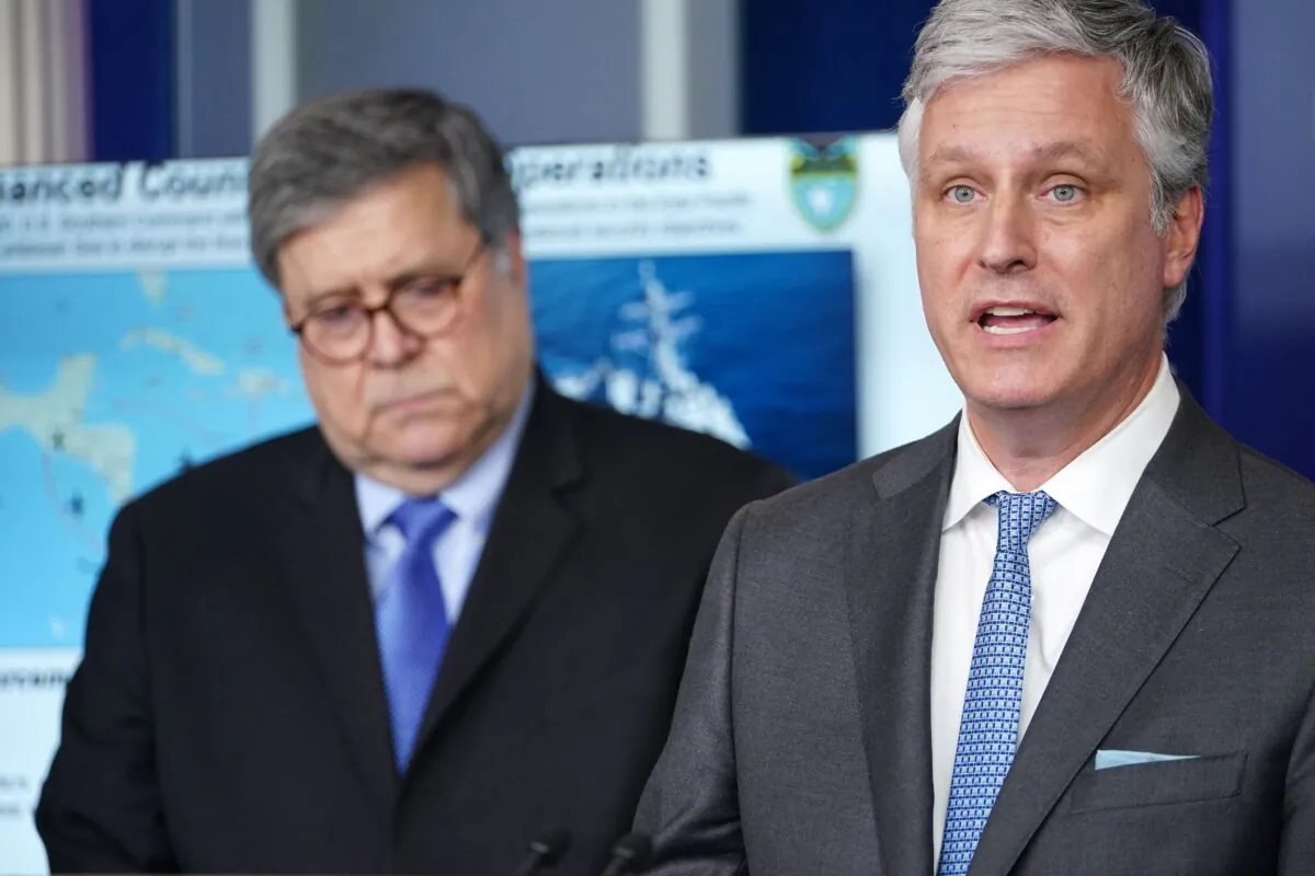 National Security Advisor Robert O'Brien (R) speaks, flanked by US Attorney General William Barr, during the daily briefing on the novel coronavirus, COVID-19, in the Brady Briefing Room at the White House on April 1, 2020, in Washington, DC. (Mandel Ngan/AFP via Getty Images)