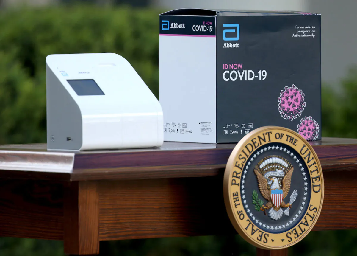 A new COVID-19 test kit developed by Abbott Labs in the Rose Garden of the White House in Washington on March 30, 2020. (Win McNamee/Getty Images)