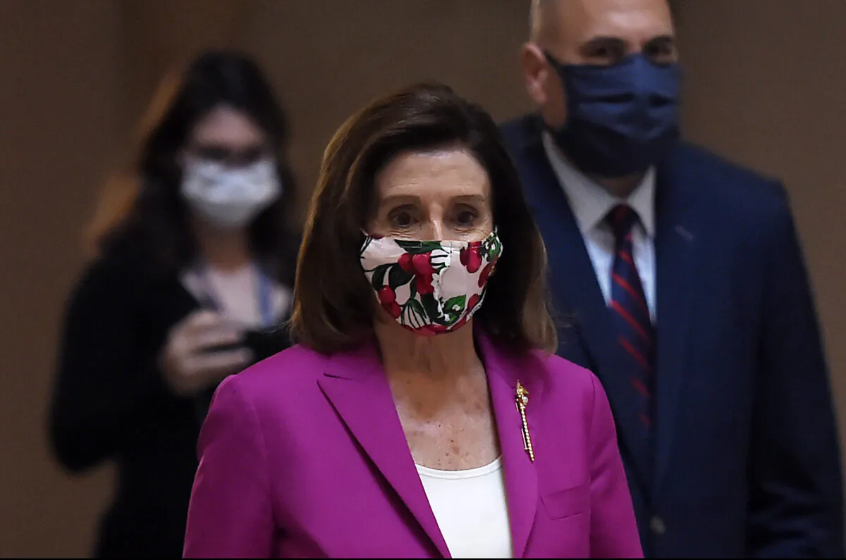House Speaker Nancy Pelosi walks past the Statuary Hall at the U.S. Capitol in Washington on May 15, 2020. (Olivier Douliery/AFP/Getty Images)