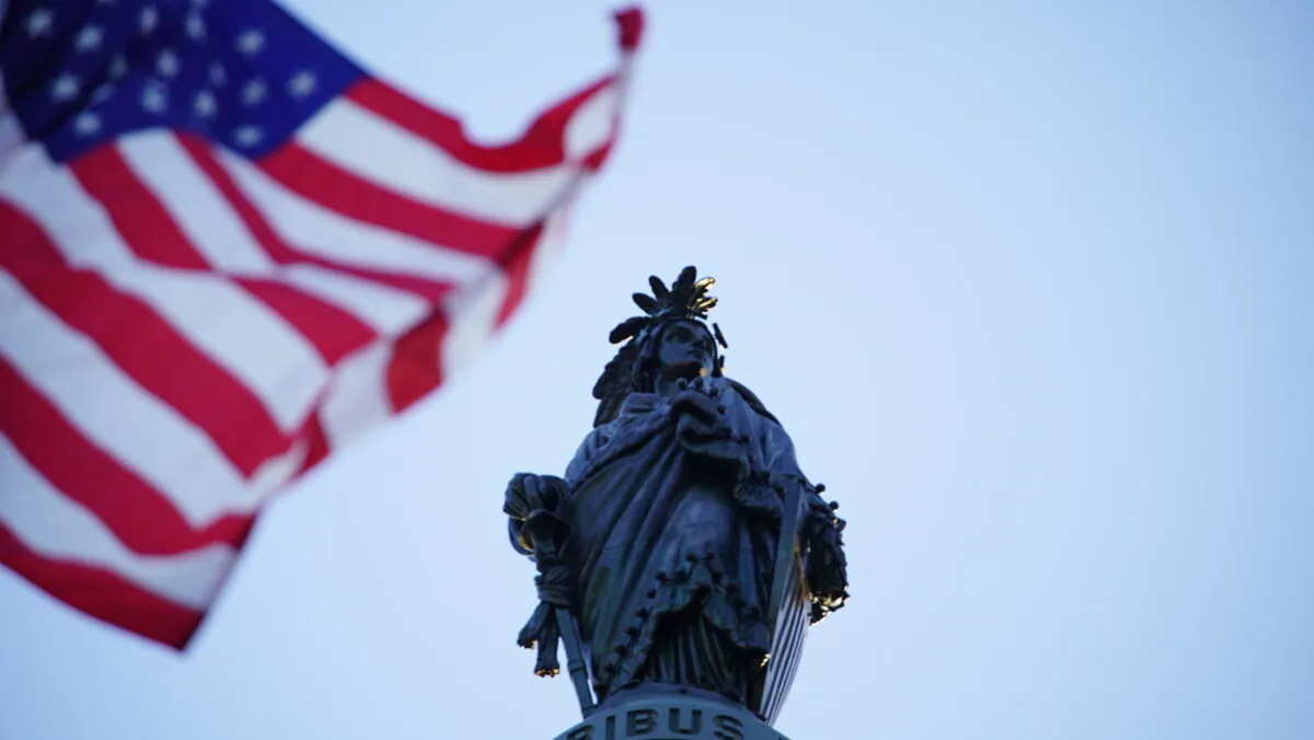 A U.S. flag flies in front of the Capitol building in Washington on May 13, 2020. (York Du/The Epoch Times)