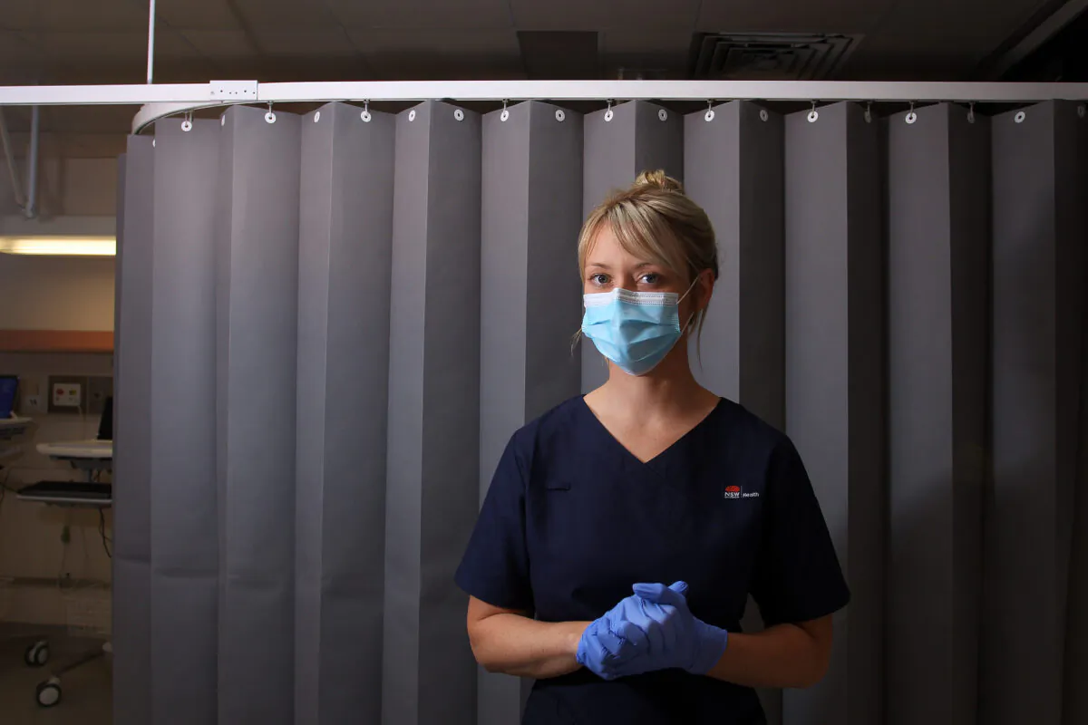 Registered Nurse Clancy Spencer poses in the clinical assessment room at St George Hospital COVID-19/ Flu Assessment Clinic on May 15, 2020 in Sydney, Australia. (Lisa Maree Williams/Getty Images)