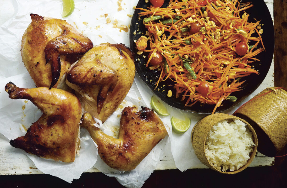 Grilled chicken, spicy salad, and sticky rice, "the so-called trinity of Isan," writes Leela Punyaratabandhu, "that has won hearts and minds the world over."  (Photo by David Loftus)