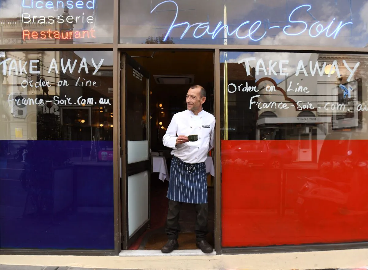 Head chef Geraud Fabre of France-Soir waits for take-away orders in Melbourne on May 8 as Australia's government unveiled a three-stage plan to get the economy back to a "new normal" by the end of July. (William West/AFP via Getty Images)