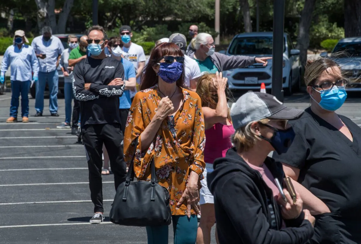 People wait to cast their votes at a polling station for the special election between Democratic state assembly woman Christy Smith and Republican businessman and ex-Navy pilot Mike Garcia to replace former Democratic Congresswoman Katie Hill in the state's 25th Congressional District, in Santa Clarita, Calif., on May 12, 2020. (Mark Ralston/AFP via Getty Images)