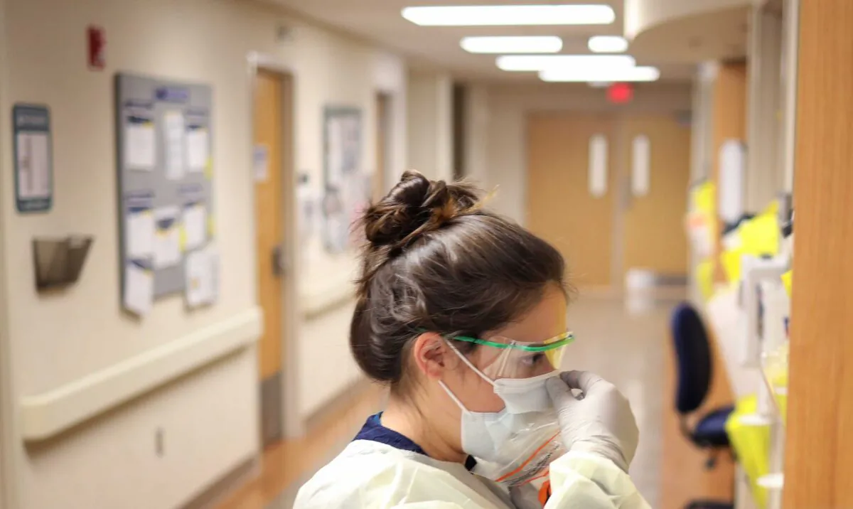 A nurse in the COVID-19 unit of MedStar St. Mary's Hospital check the fit of protective equipment before entering a patient's room in Leonardtown, Md., on March 24, 2020. (Win McNamee/Getty Images)