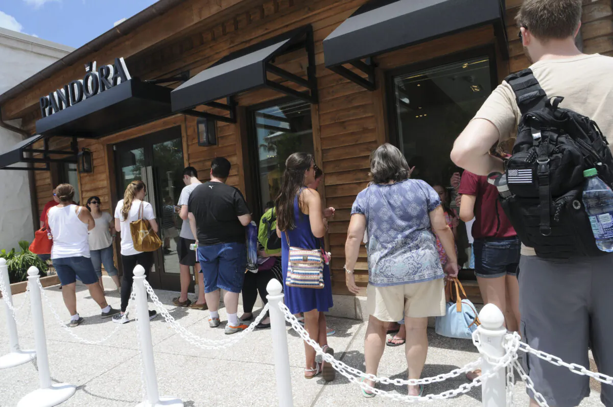 Guests attend the PANDORA Jewelry At Disney Springs Grand Opening in Buena Vista, Fla. on May 21, 2016. (Gerardo Mora/Getty Images for PANDORA)