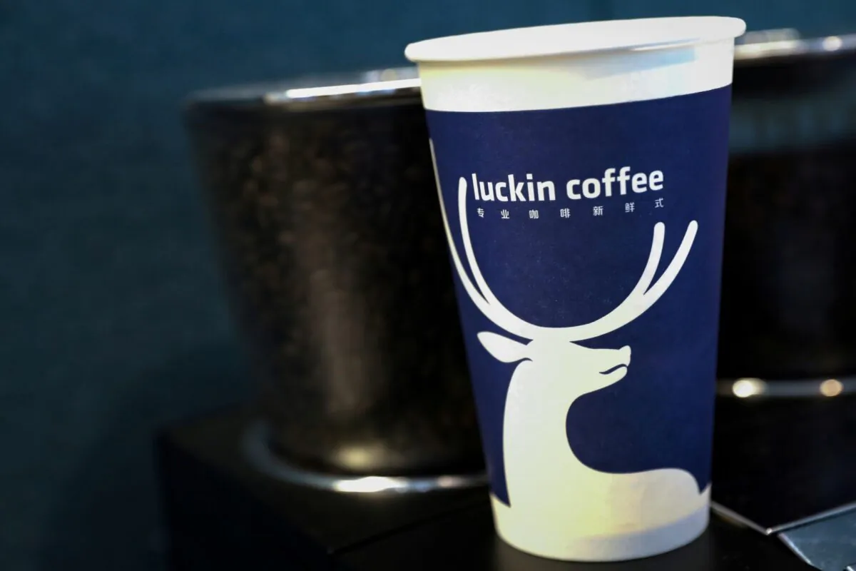 A cup of 'Luckin Coffee' coffee is displayed during the company's IPO at the Nasdaq Market site in New York on May 17, 2019. (Brendan McDermid/File/Reuters) Photo/File Photo