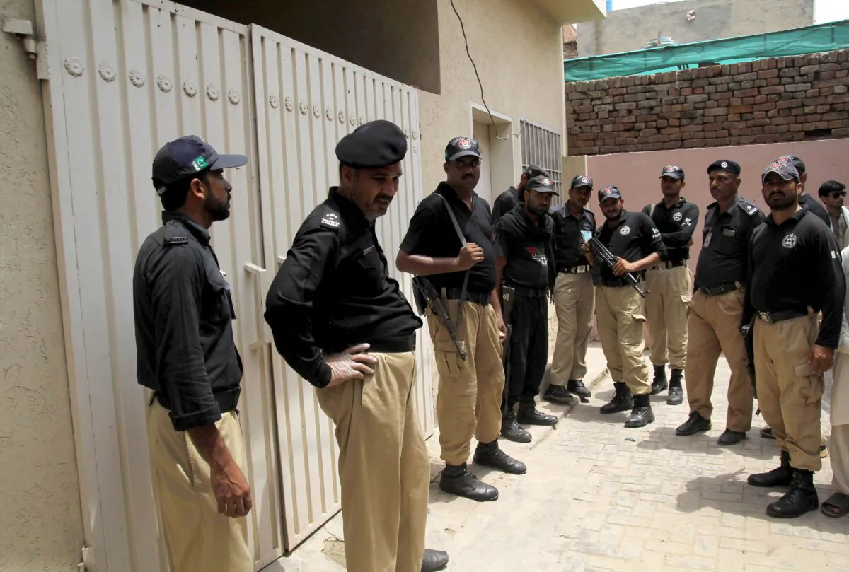File photo of Pakistani policemen standing guard outside the house of another suspected honor killing victim, social media celebrit Qandeel Baloch who was murdered by her brother, in Multan on July 16, 2016. (Shahid Saeed Mirza/AFP/Getty Images)