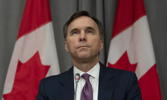 Minister of Finance Bill Morneau listens to a question during a news conference Friday May 1, 2020 in Ottawa. (Adrian Wyld/THE CANADIAN PRESS)