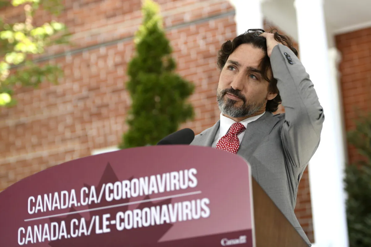 Prime Minister Justin Trudeau listens to a question during his daily news conference on the COVID-19 pandemic outside his residence at Rideau Cottage in Ottawa, on  May 20, 2020. (Justin Tang/THE CANADIAN PRESS)