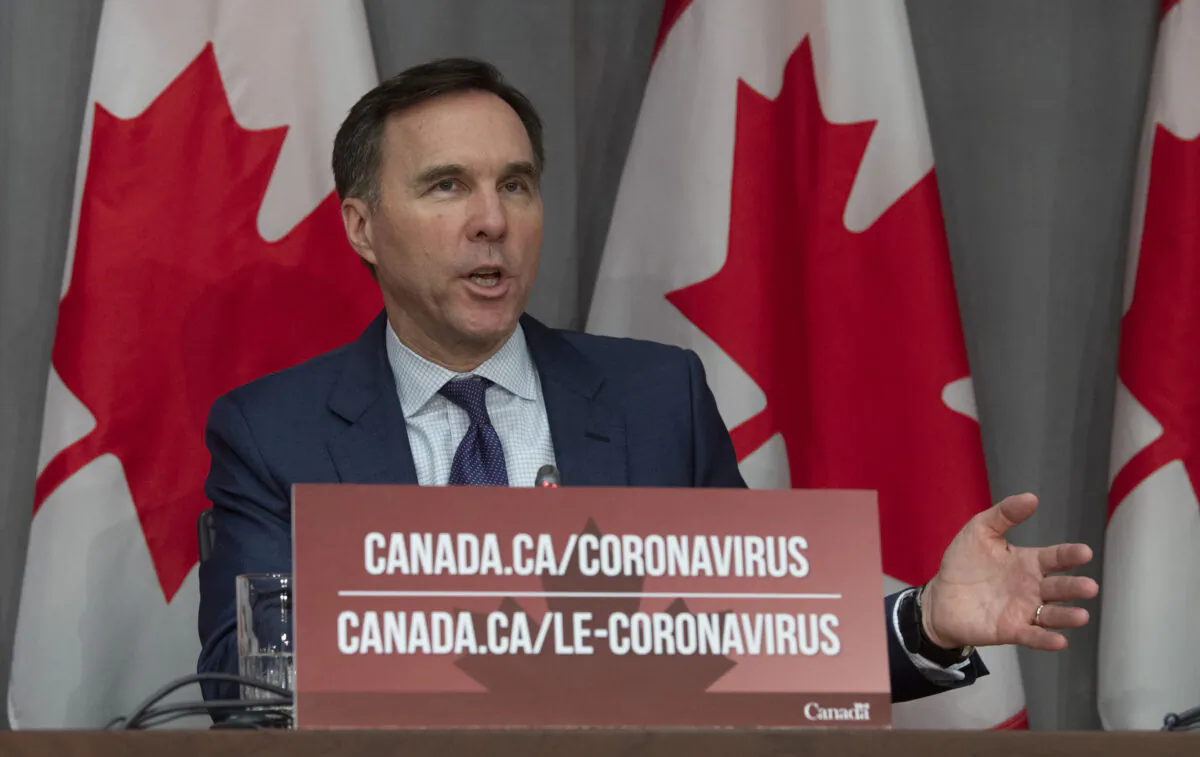 Finance Minister Bill Morneau responds to a question during a news conference in Ottawa on March 27, 2020. (The Canadian Press/Adrian Wyld)