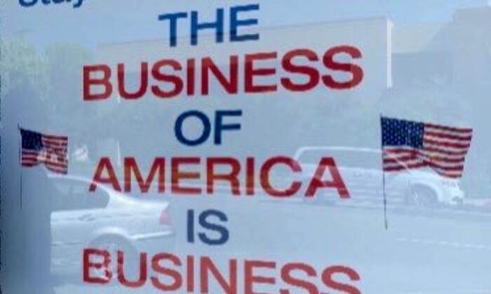 A sign supporting American business hangs in the window of a shop that has been closed due to the COVID-19 pandemic, in Los Angeles, Calif. (Courtesy of shopkeeper)