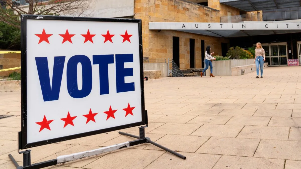 Voters enter and exit the Austin City Hall during the presidential primary in Austin, Texas, on March 3, 2020. (Suzanne Cordeiro/AFP via Getty Images)