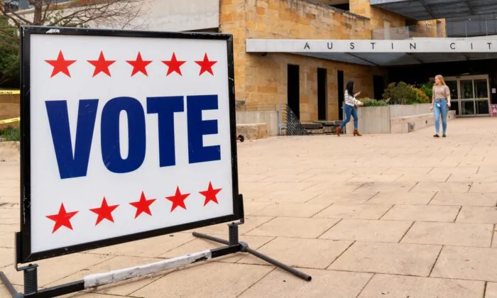 Voters enter and exit the Austin City Hall during the presidential primary in Austin, Texas, on Super Tuesday, March 3, 2020. (Suzanne Cordeiro/AFP via Getty Images)