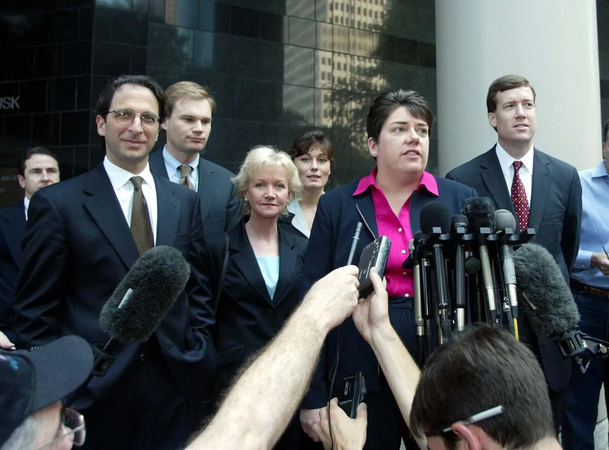 File photo showing federal prosecutors Andrew Weissmann (L), Matt Friedrich (2nd L, back), FBI agent Barbara Sullivan (3rd L), FBI agent Paula Shanzel (3rd R, back), US Assistant District Attorney Leslie R. Caldwell (2nd R) and prosecutor Sam Buell (R), in Houston, Texas, on15 June 2002. (JAMES NIELSEN/AFP via Getty Images)