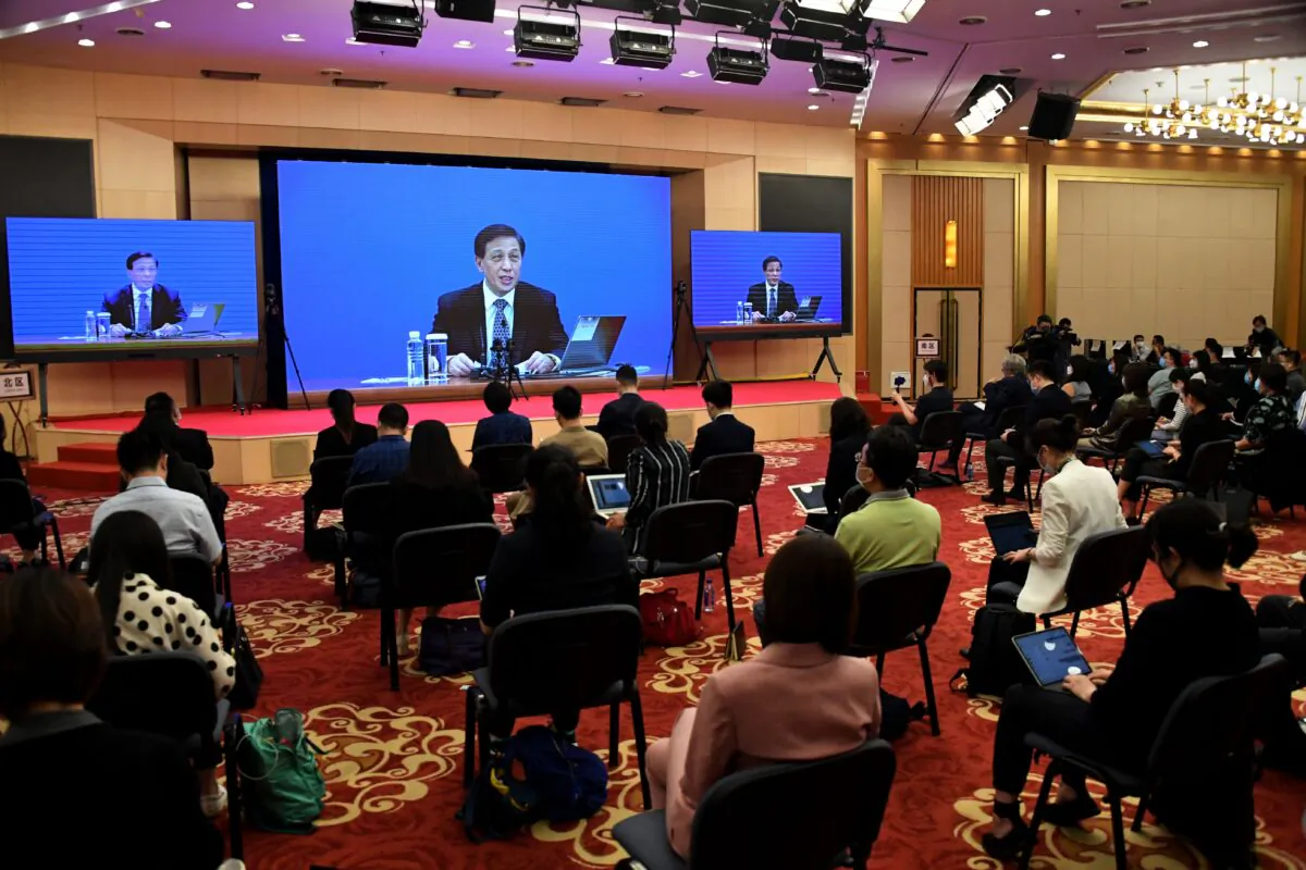 Zhang Yesui, the spokesperson for the third session of the 13th National People's Congress, speaks during a video online press conference in Beijing a day before the opening ceremony of the NPC, on May 21, 2020. Zhang said the NPC will discuss a proposal for a national security law in Hong Kong at its annual session. (Leo Ramirez/AFP via Getty Images)