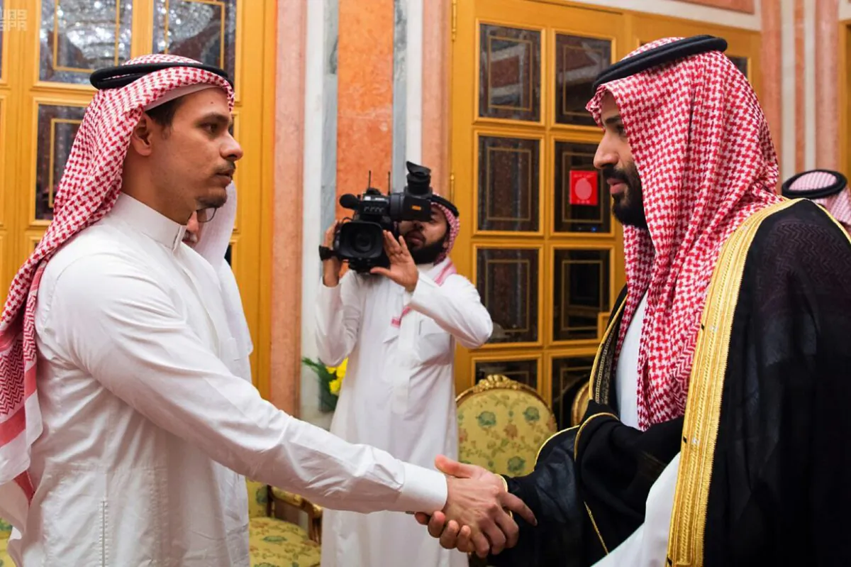 Salah Khashoggi, (L), a son of Jamal Khashoggi, shakes hands with Saudi Crown Prince Mohammed bin Salman in Riyadh, Saudi Arabia on Oct. 23, 2018. (Saudi Press Agency via AP)