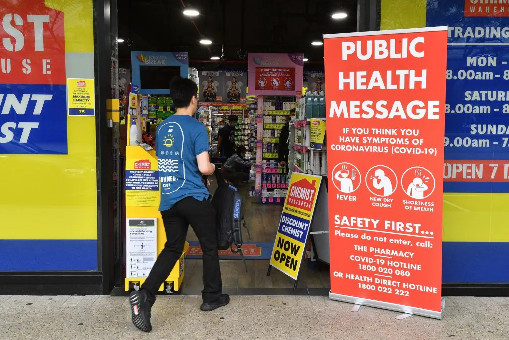 A man enters a pharmacy in Sydney on March 27, 2020. Australia is heavily dependent on China for the provision of pharmaceuticals and health-related products. (Saeed Khan/AFP via Getty Images)