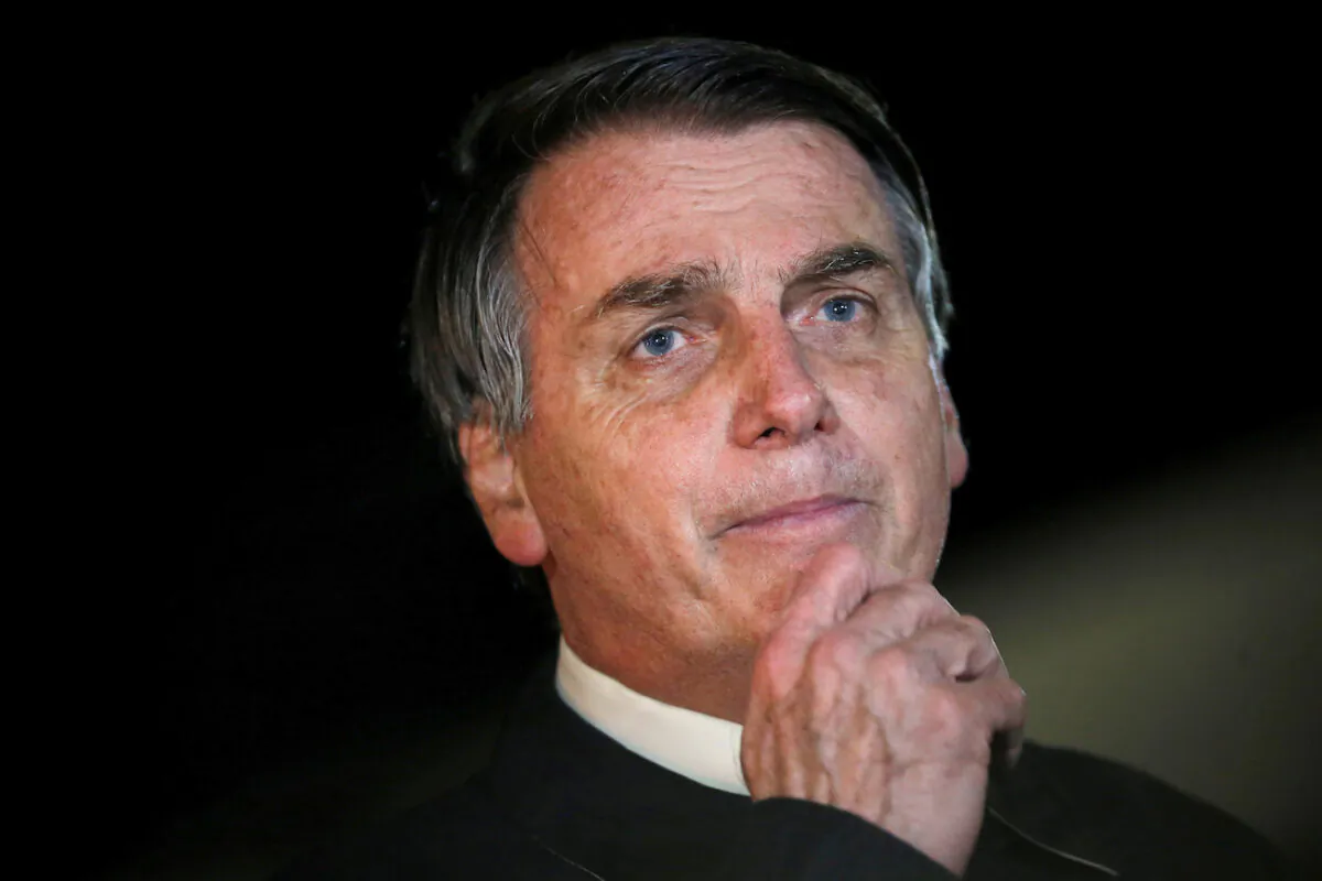 Brazil's President Jair Bolsonaro speaks with journalists as he arrives at Alvorada Palace, amid the COVID-19 outbreak, in Brasilia, Brazil, May 22, 2020. (Adriano Machado/Reuters)