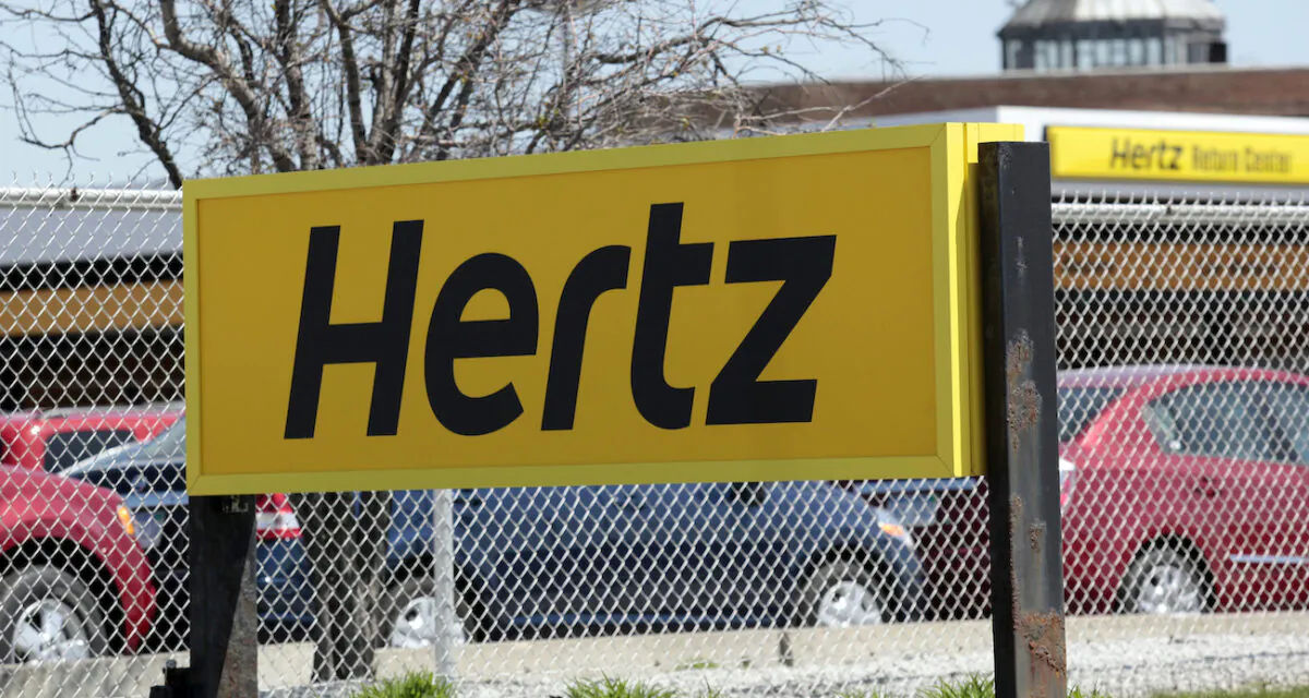 A Hertz rental car sign is placed outside a rental lot near Detroit Metropolitan airport in Romulus, Mich., on May 9, 2011. (Rebecca Cook/Reuters)