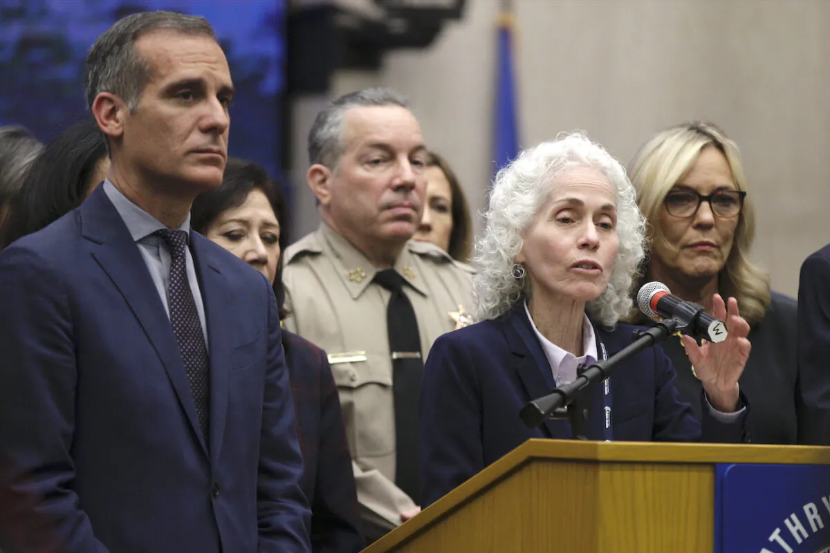Los Angeles County Public Health Director Barbara Ferrer speaks at a news conference with Los Angeles Mayor Eric Garcetti (L) in Los Angeles on March 12, 2020. (Damian Dovarganes,File/AP Photo)