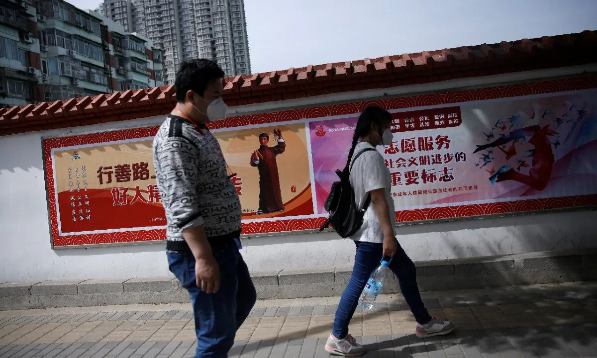 Migrant worker Zhang Jianpeng, 28, and his wife Zhang Ruirui, 26, on May 13, 2020. (Tingshu Wang/ Reuters)