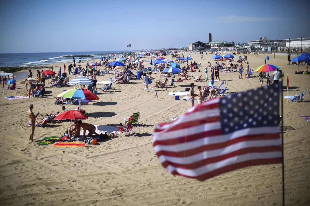 People visit the beach during Memorial Day weekend on May 26, 2019 in Asbury Park, New Jersey. (Kena Betancur/Getty Images)