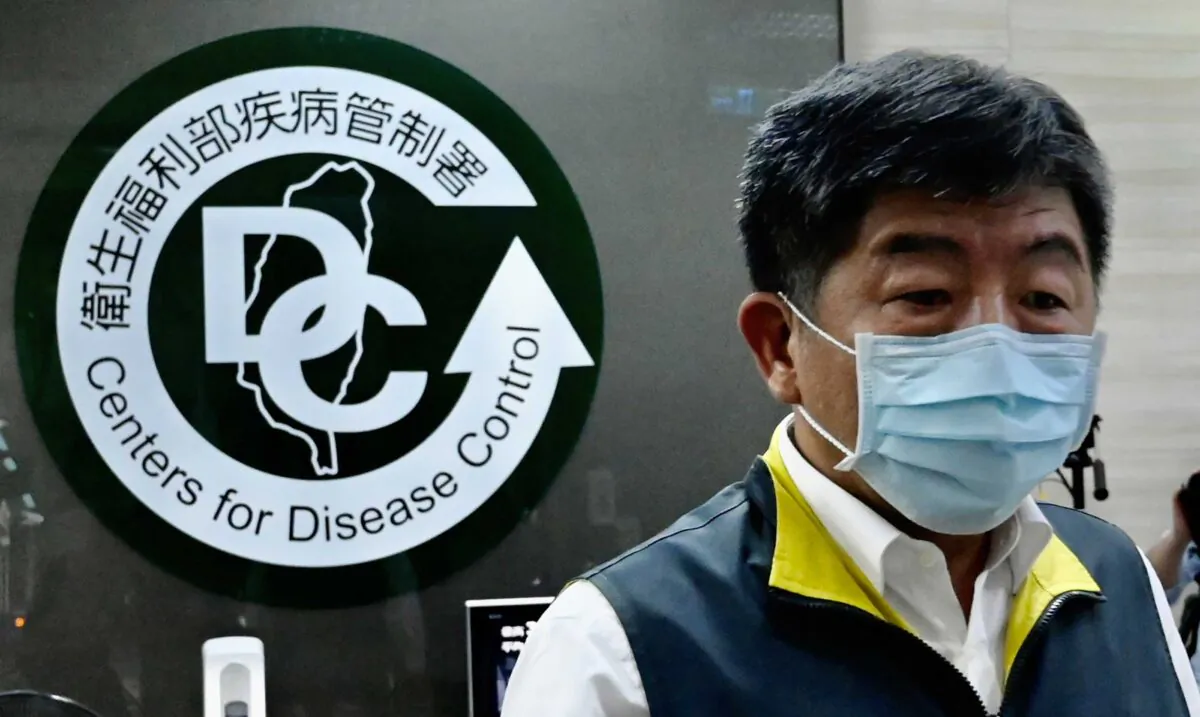Taiwan's Health and Welfare Minister Chen Shih-chung walks past a logo for the Taiwan Centers for Disease Control (CDC) ahead of the arrival of President Tsai Ing-wen in Taipei on May 19, 2020. (Sam Yeh/AFP via Getty Images)
