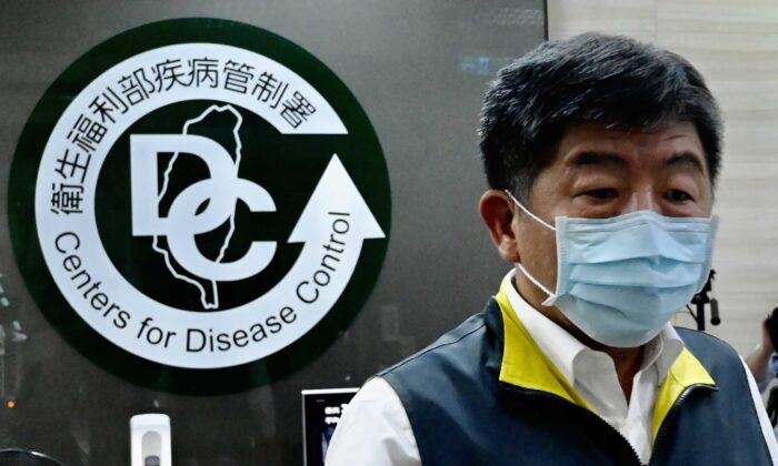 Taiwan's Health and Welfare Minister Chen Shih-chung walks past a logo for the Taiwan Centers for Disease Control (CDC) ahead of the arrival of President Tsai Ing-wen in Taipei on May 19, 2020. (Sam Yeh/AFP via Getty Images)