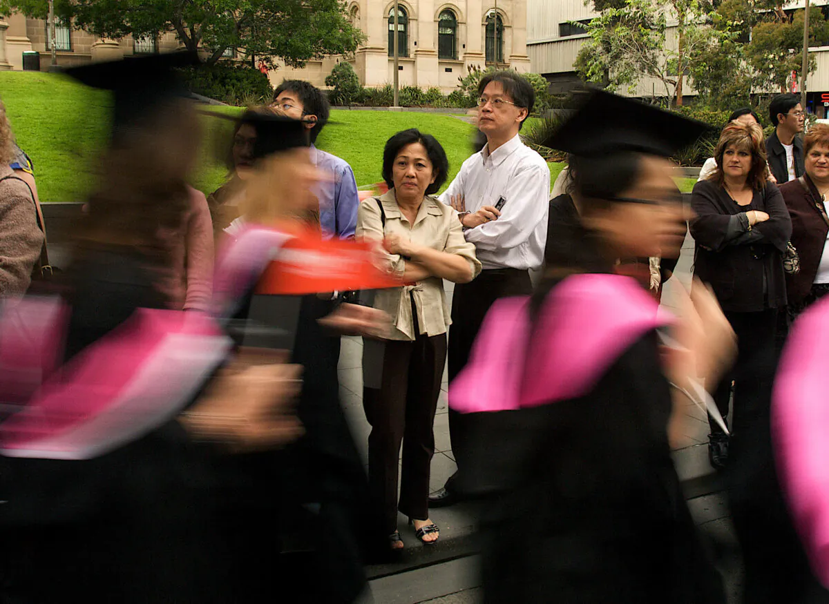 students took part in a parade on Swanston Street to celebrate their graduation from a University in Melbourne, Australia, December 17, 2008.  (Luis Enrique Ascui/Getty images)