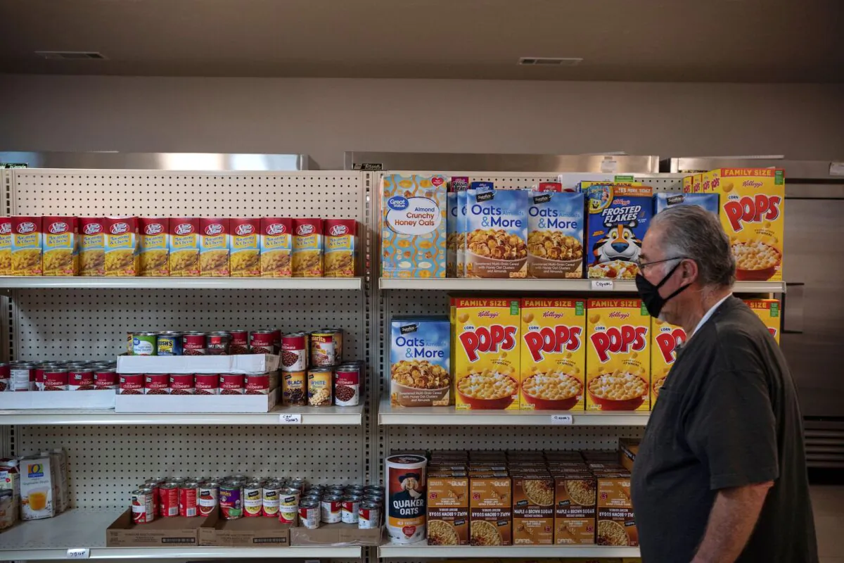 A volunteer at Jonah's House Food Pantry fills a bag of food in Carlsbad, N.M., on May 7, 2020. (Paul Ratje/AFP/Getty Images)