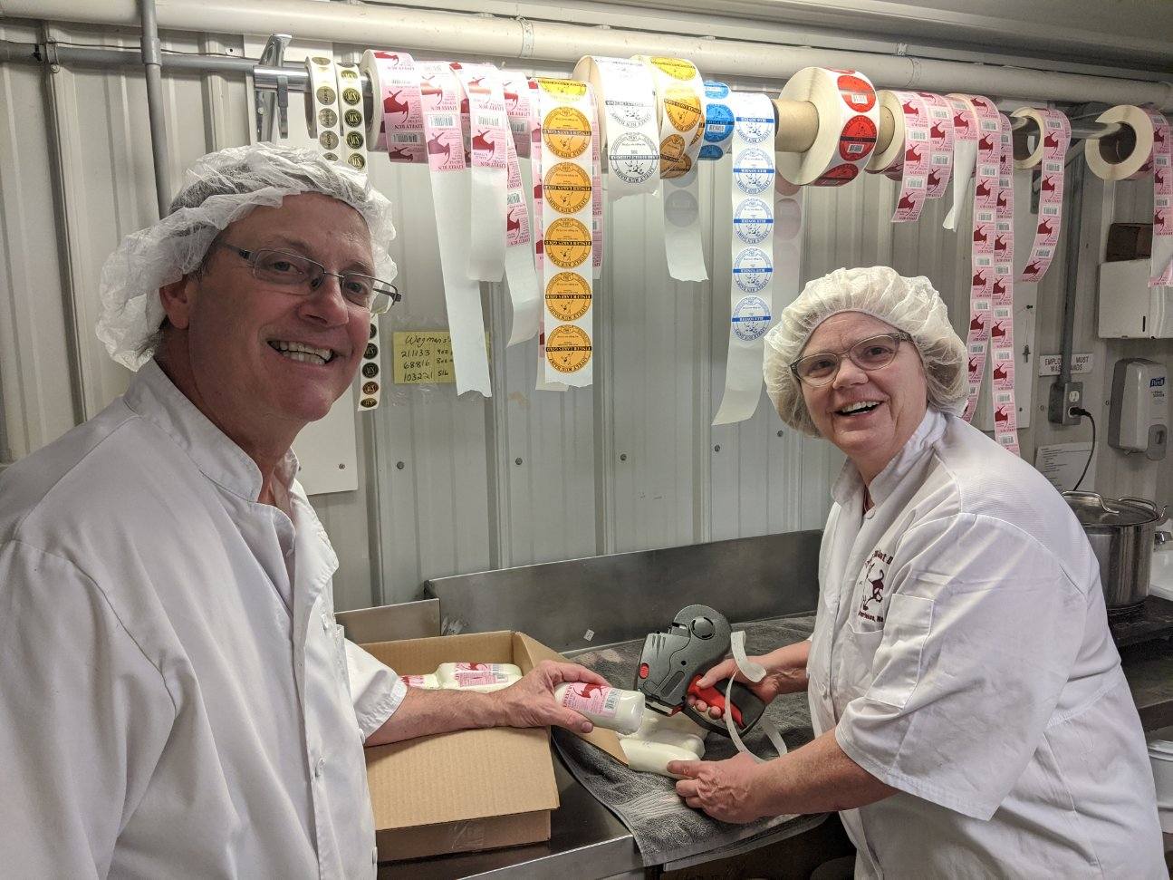 Steve and Susanne Messmer packaging cheese donations