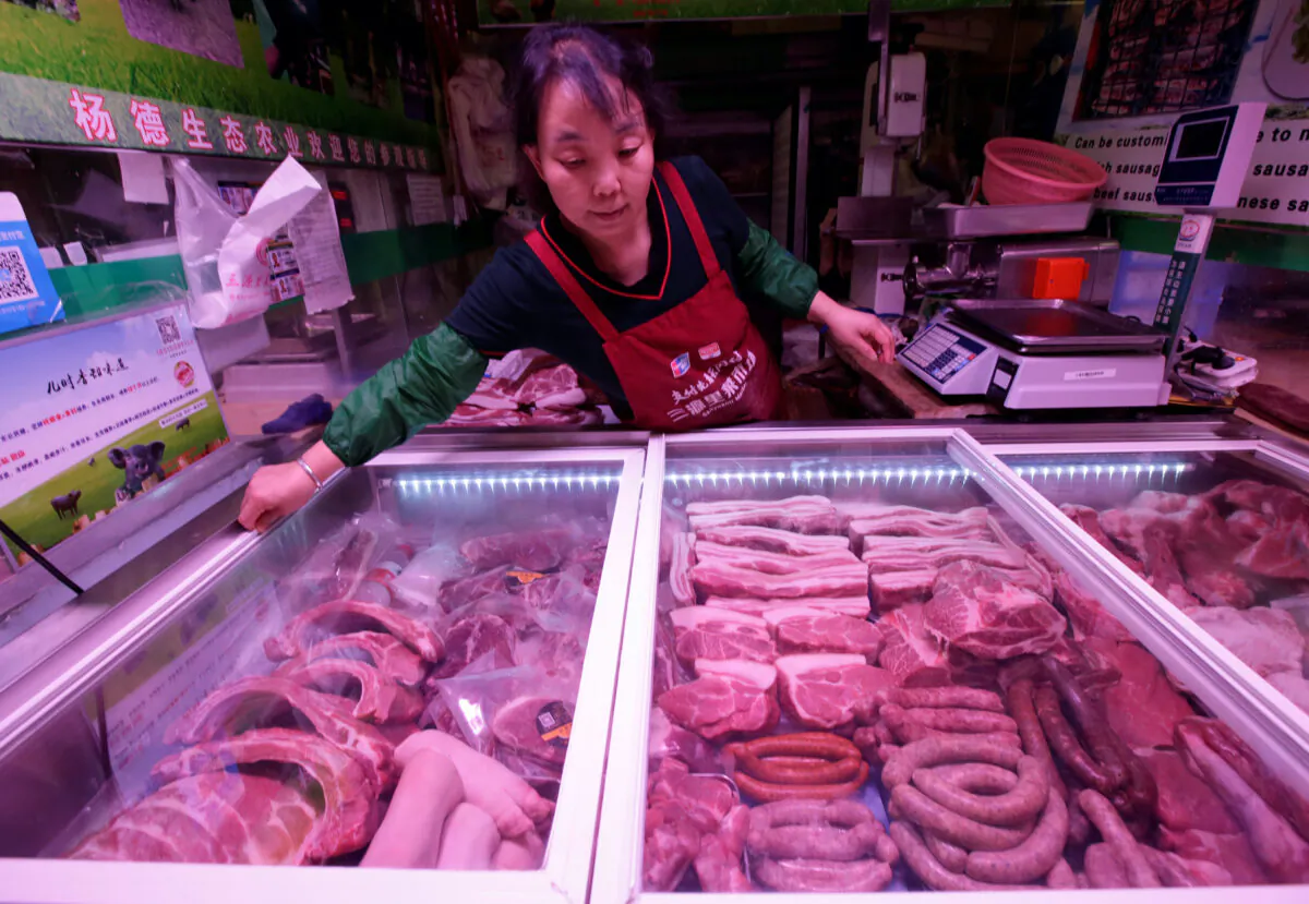 Pork for sale is seen at Sanyuanli market in Beijing on May 23, 2019. (Jason Lee/Reuters)