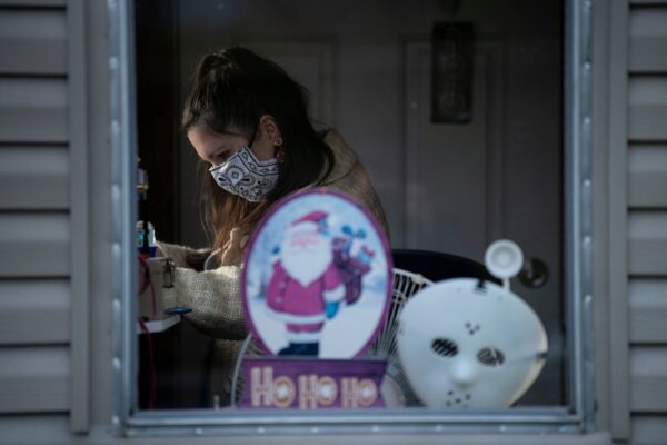 Jonell Cooper waits to check moviegoers' tickets at the Family Drive-In Theatre