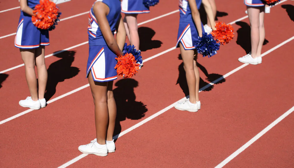 Cheerleaders standing in a line. (Illustration - Stephen Coburn/Shutterstock)  