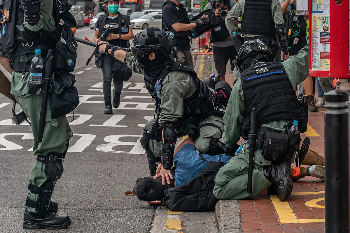 A pro-democracy supporter is detained by riot police in Hong Kong on May 24, 2020. (Anthony Kwan/Getty Images)