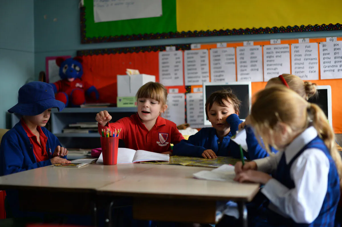 6 years old student Frances McMillan (2nd L) studies with classmates inside a classroom at school in the Coogee suburb of Sydney on June 17, 2013. (Saeed Khan/Getty Images)