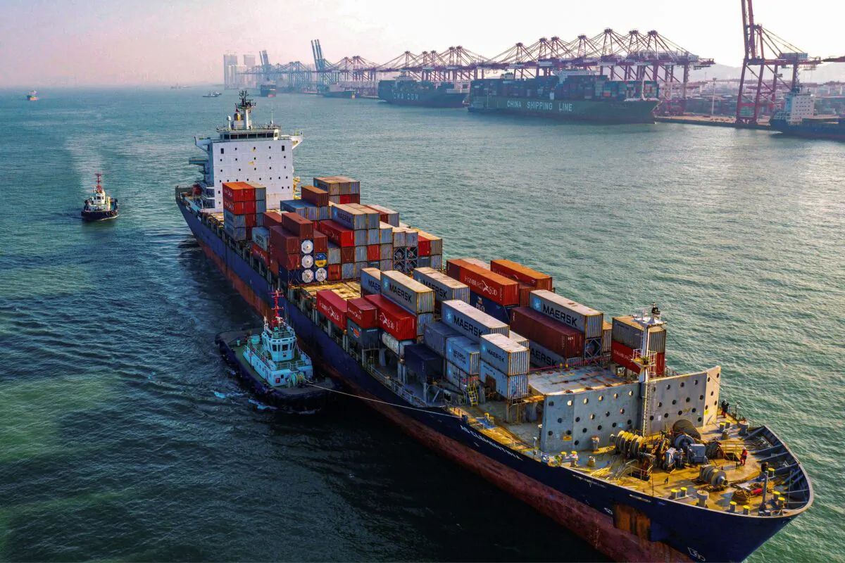 A cargo ship loaded with containers makes its way to a port in Qingdao city, Shandong Province, China, on Jan. 14, 2020. (AFP via Getty Images)